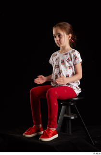 Lilly  1 dressed red leggings red shoes sitting t…